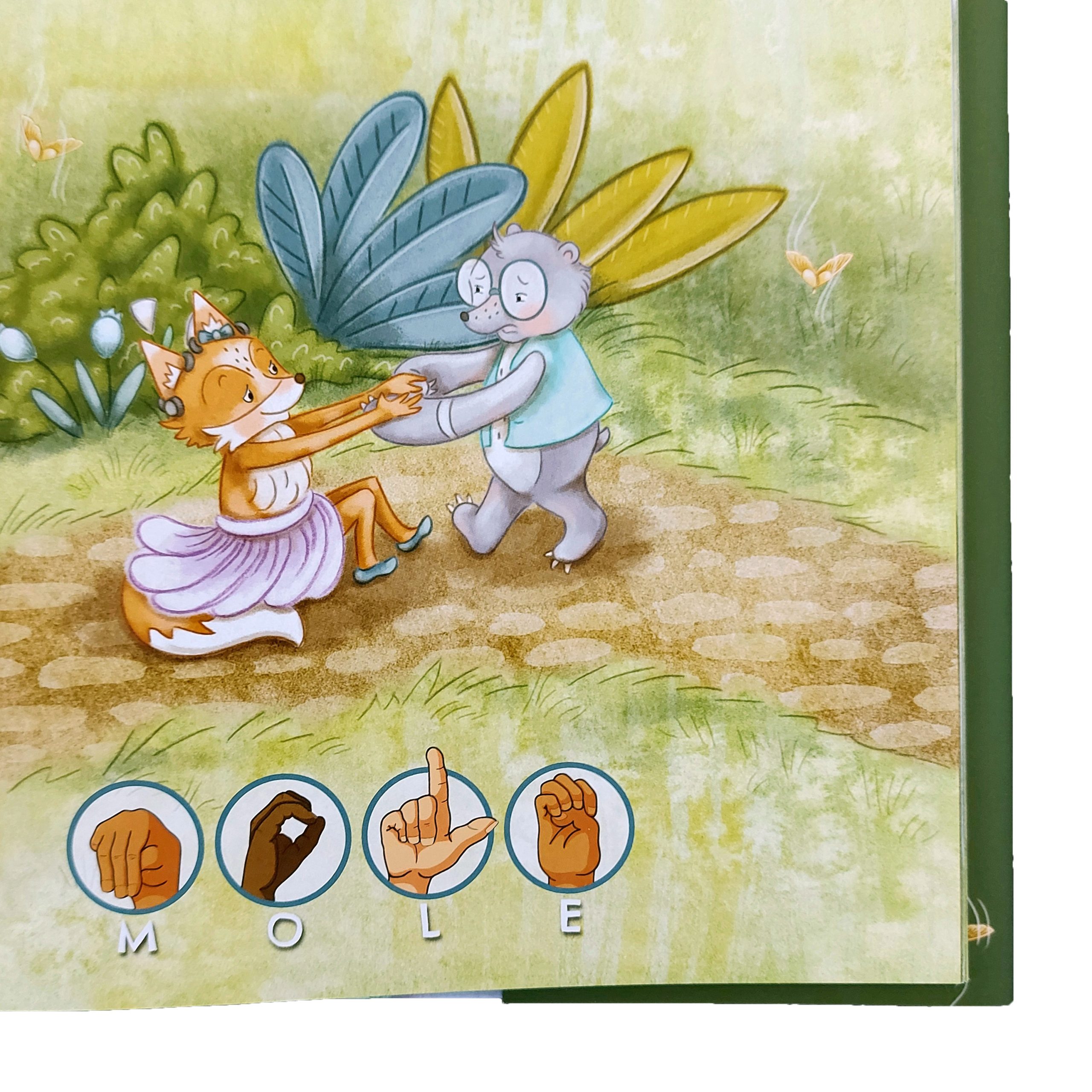 A corner of the Ada and the Helpers children's book showing an illustration of a mole helping Ada the fox up. MOLE is spelled out using the manual alphabet.
